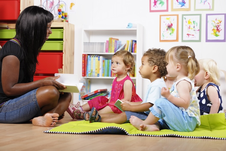 Daycare teacher with a group of preschoolers/toddlers
