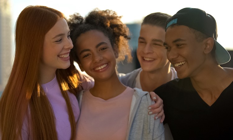 close-up of a group of four happy teens